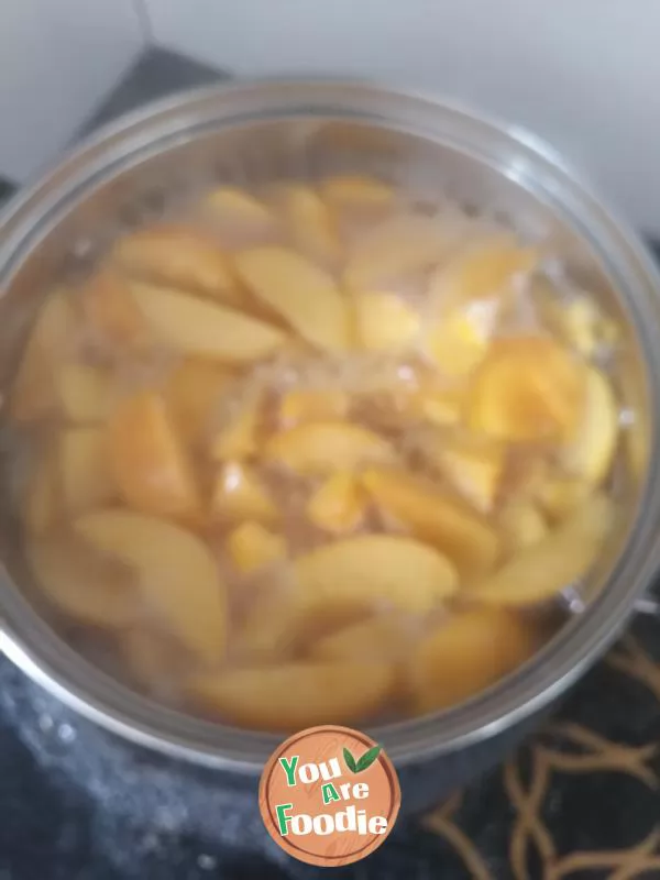 Canned yellow peach syrup