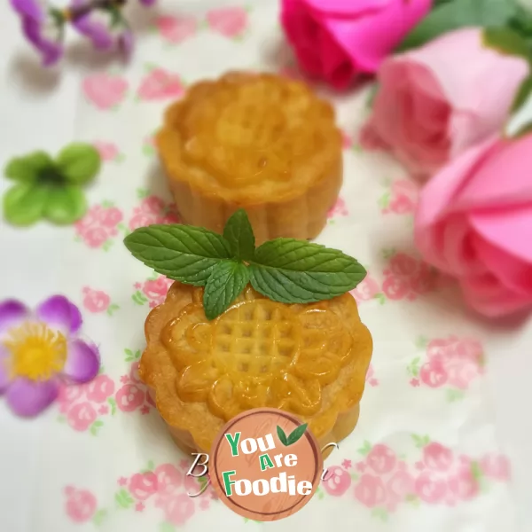 Cantonese style moon cake with lotus seed paste and egg yolk