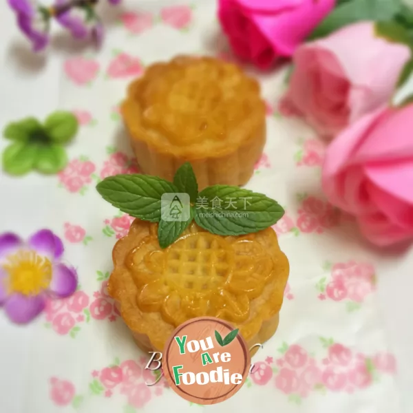 Cantonese style moon cake with lotus seed paste and egg yolk