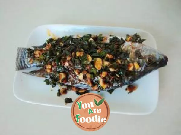 Steamed fish with ginger leaves in chili sauce