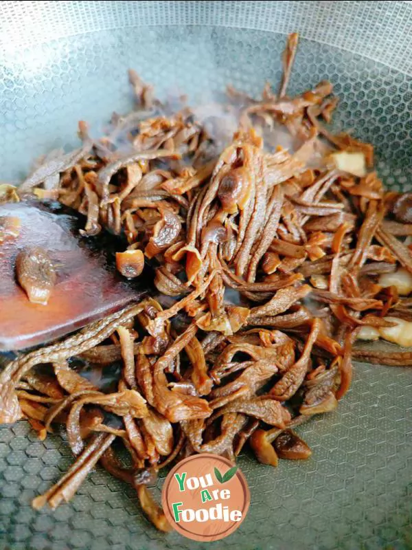 Fried meat with antler mushrooms