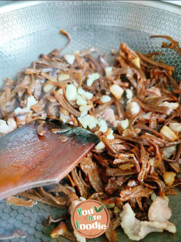 Fried meat with antler mushrooms