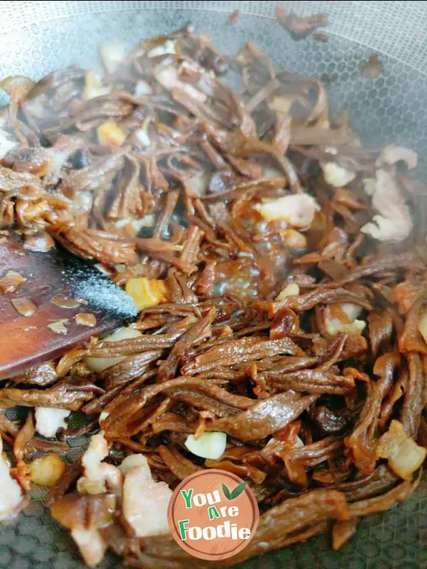 Fried meat with antler mushrooms