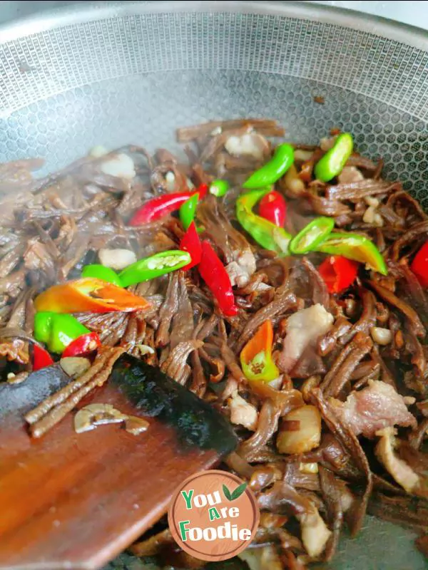 Fried meat with antler mushrooms