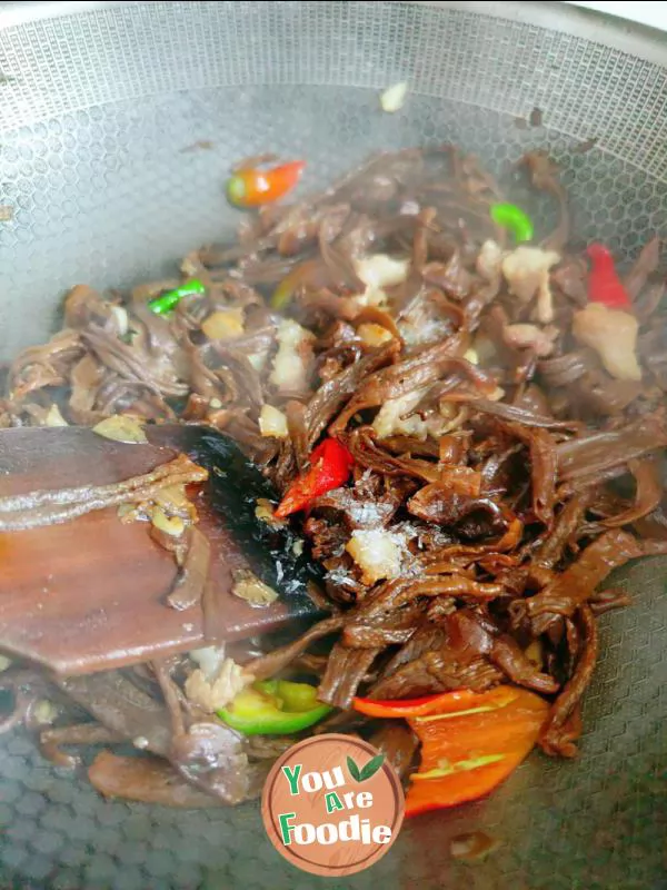 Fried meat with antler mushrooms