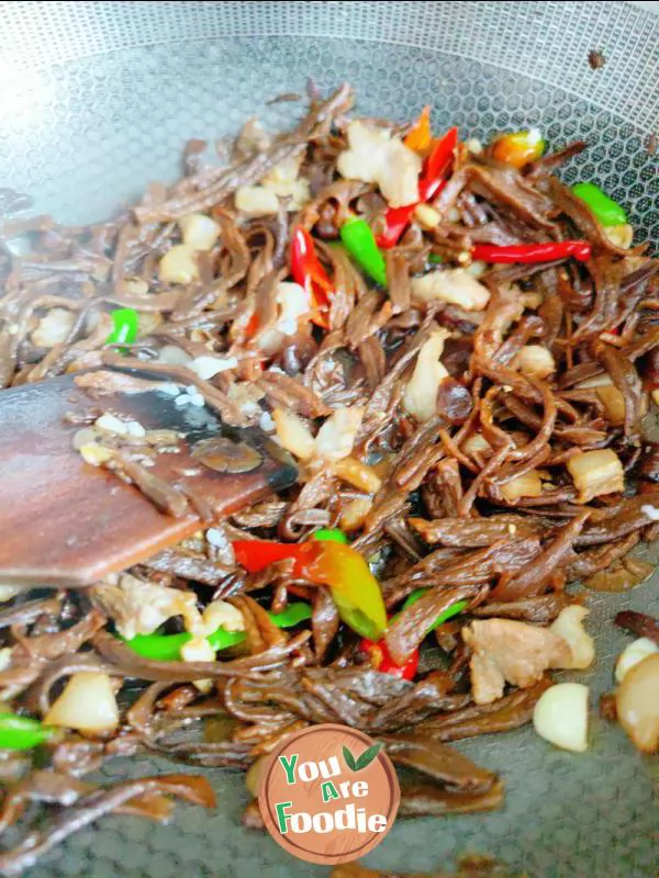 Fried meat with antler mushrooms