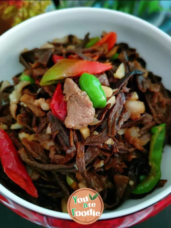 Fried meat with antler mushrooms