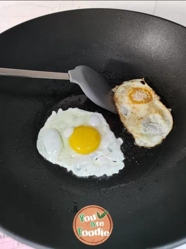 Fried egg with pepper and salt