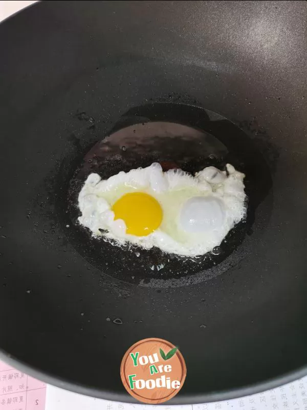 Fried egg with pepper and salt