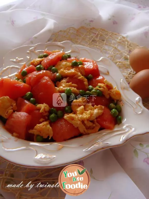 Scrambled eggs with tomatoes and peas