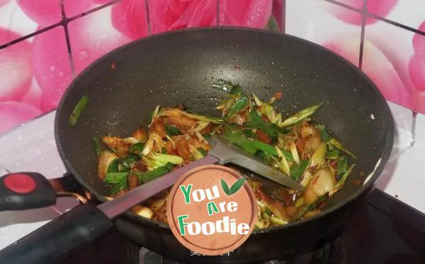 Fried meat with garlic sprouts