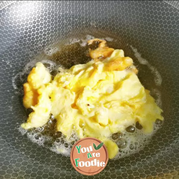 Fried egg with towel gourd