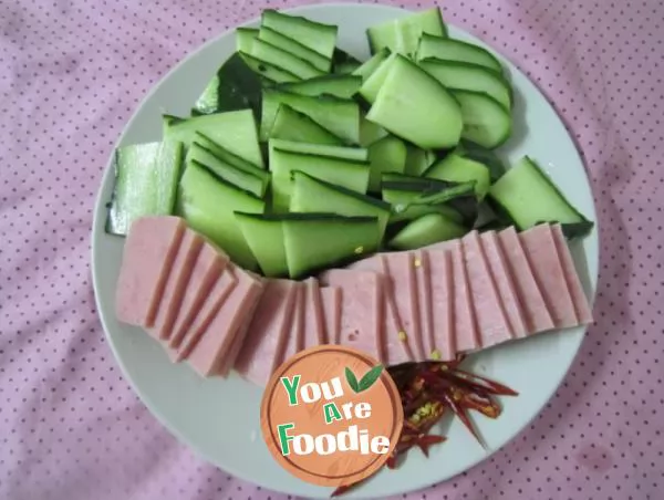 Fried ham and egg with cucumber