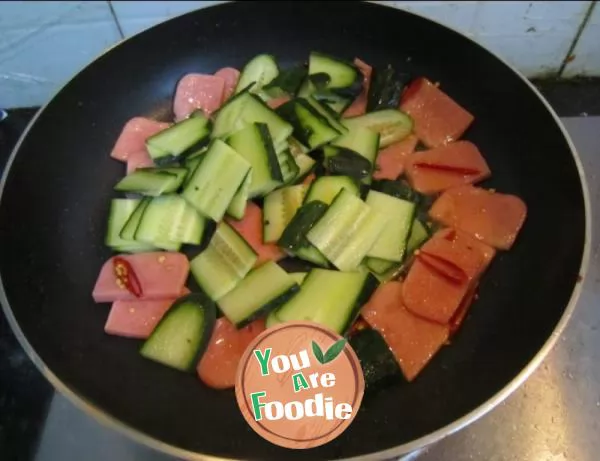 Fried ham and egg with cucumber