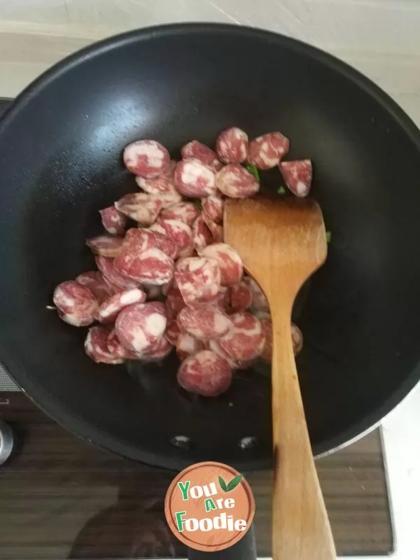 Fried green garlic with preserved meat