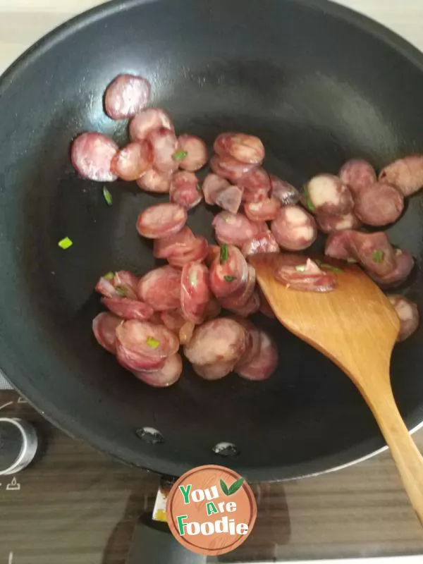 Fried green garlic with preserved meat