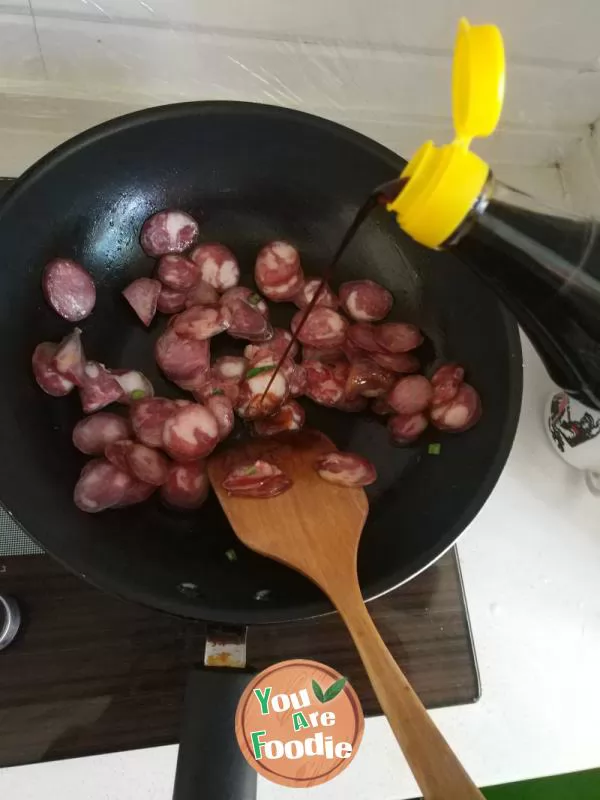 Fried green garlic with preserved meat