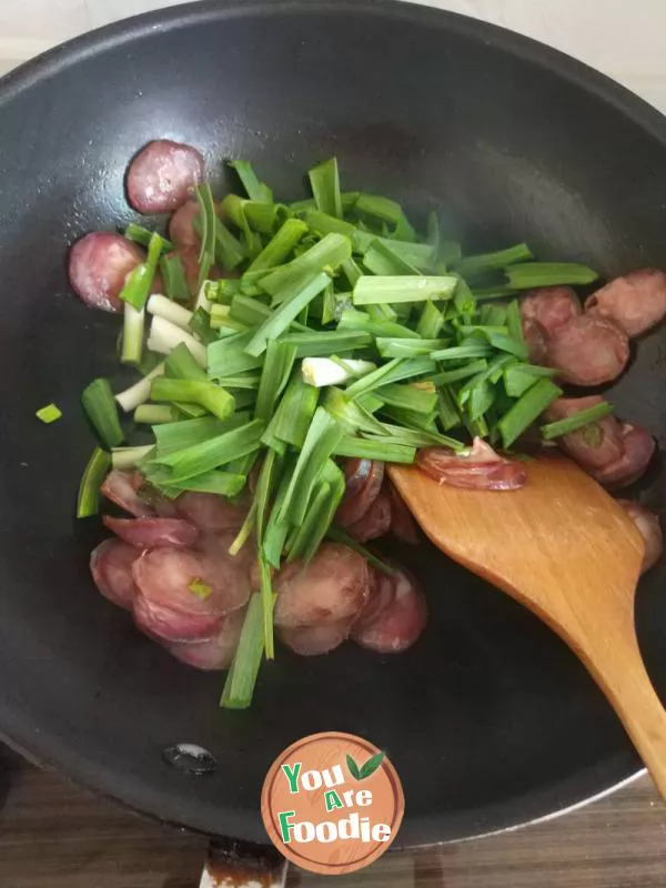 Fried green garlic with preserved meat