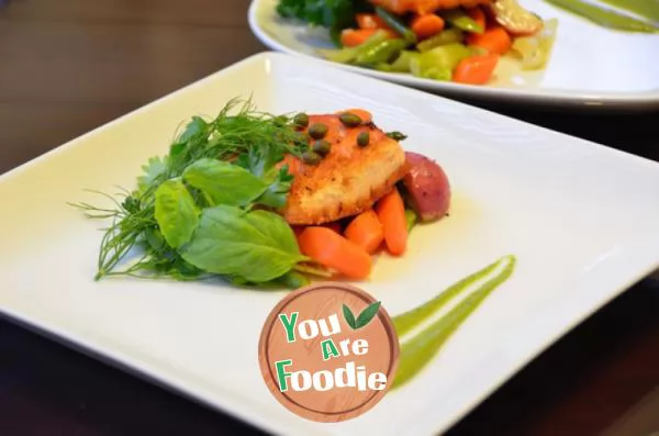 Pan fried salmon and vegetables with salsa Verde