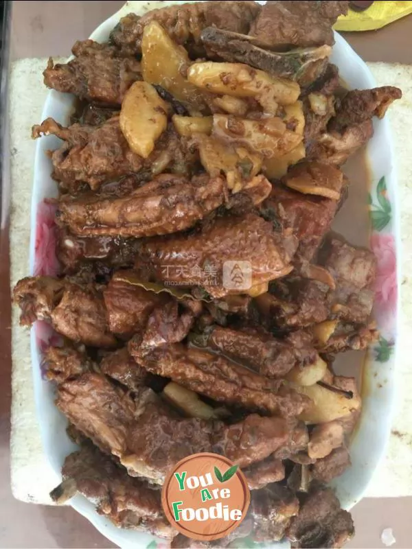 Stewed potato with pork chop and chicken wings