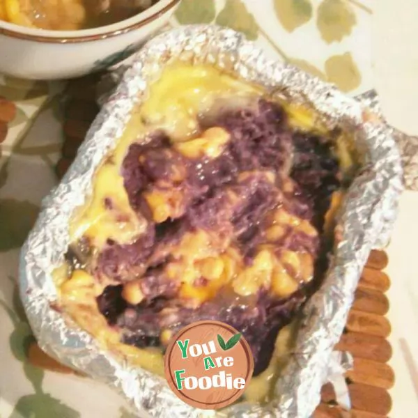 Baked purple potato with cheese