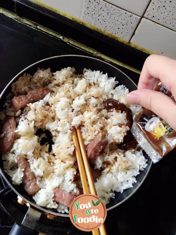 Baked rice with black pepper steak and meat cheese