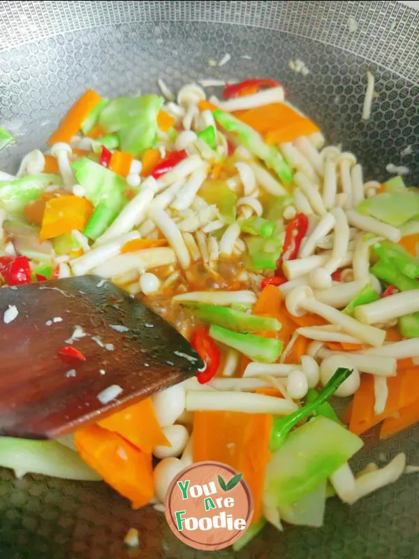 Fried eggs with seafood mushrooms and carrots