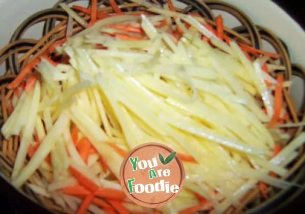 Kwai dish on holiday table -- stir fried shredded potato with hot and sour sauce