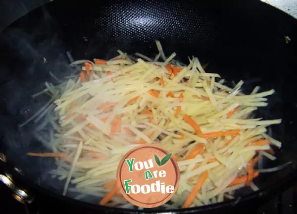 Kwai dish on holiday table -- stir fried shredded potato with hot and sour sauce