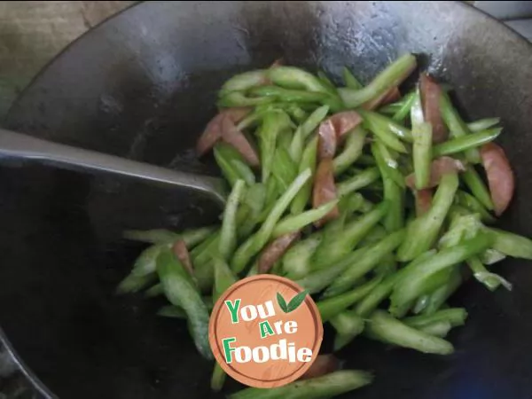 Fried sausage with celery